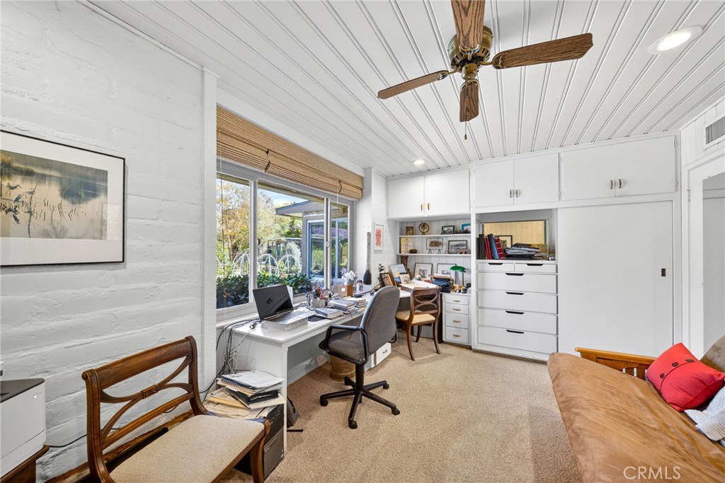 4872 N Arcade Fresno, CA 93704 - Photo 37 of 75 a view of a workspace with furniture and a window