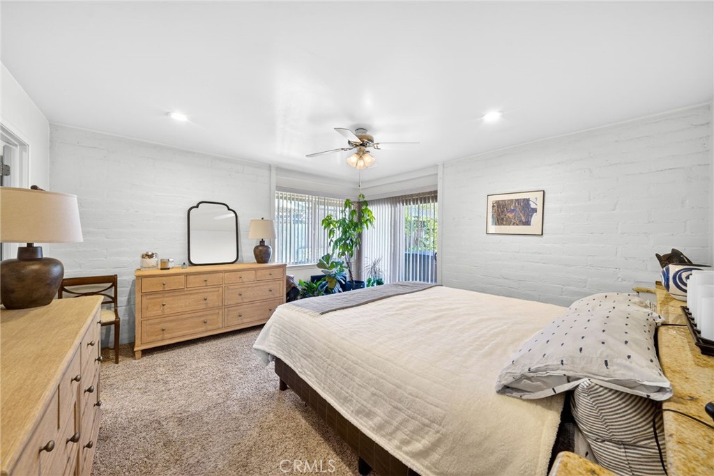 4872 N Arcade Fresno, CA 93704 - Photo 39 of 75 a very nice looking bedroom with a large bed and a dresser