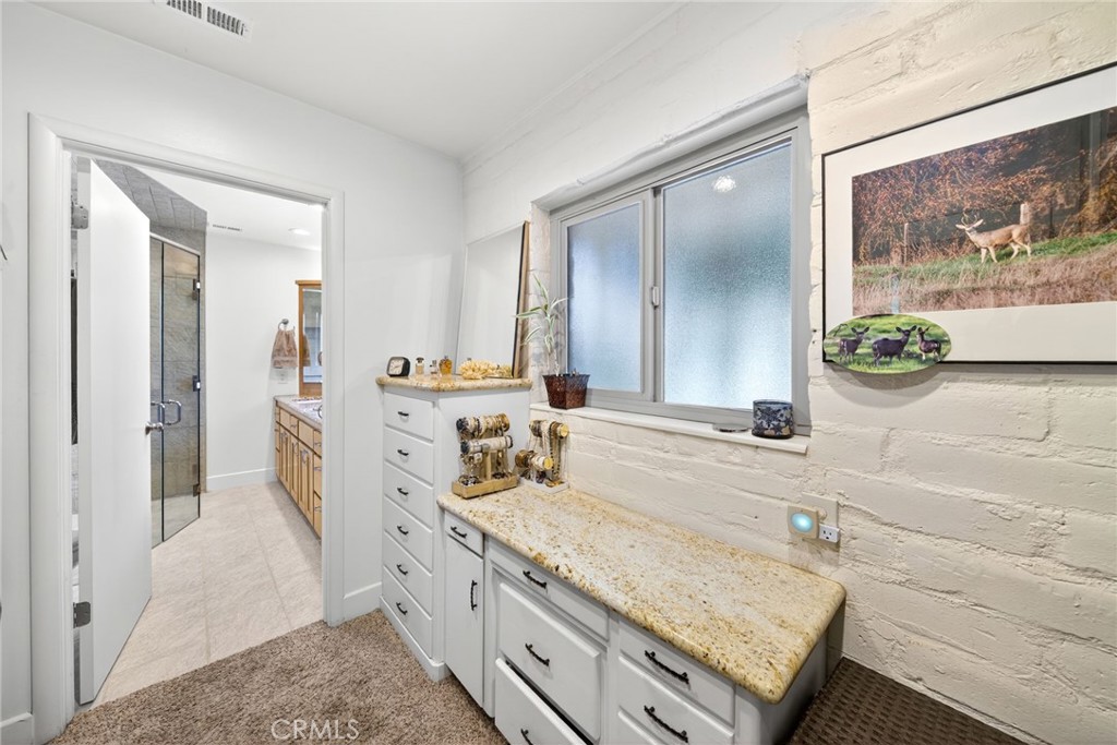 4872 N Arcade Fresno, CA 93704 - Photo 41 of 75 a spacious bathroom with a granite countertop tub sink and mirror