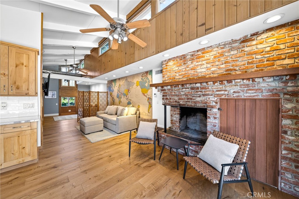 4872 N Arcade Fresno, CA 93704 - Photo 46 of 75 a living room with furniture and a fireplace