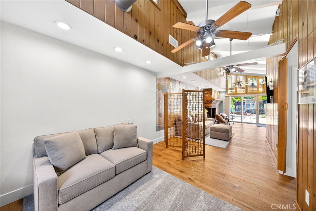 4872 N Arcade Fresno, CA 93704 - Photo 54 of 75 a living room with furniture and a chandelier