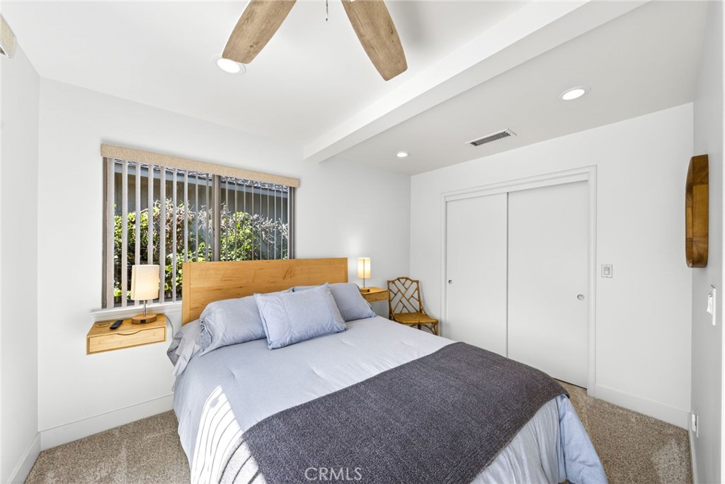 4872 N Arcade Fresno, CA 93704 - Photo 58 of 75 a bedroom with a bed and a night stand