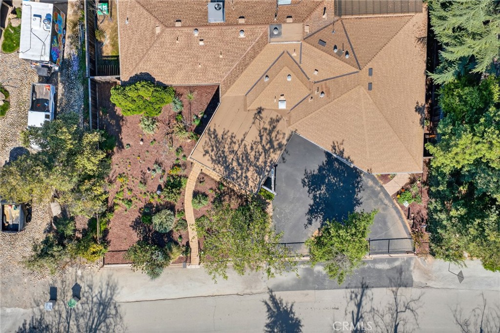 4872 N Arcade Fresno, CA 93704 - Photo 73 of 75 an aerial view of a house with a yard and large trees