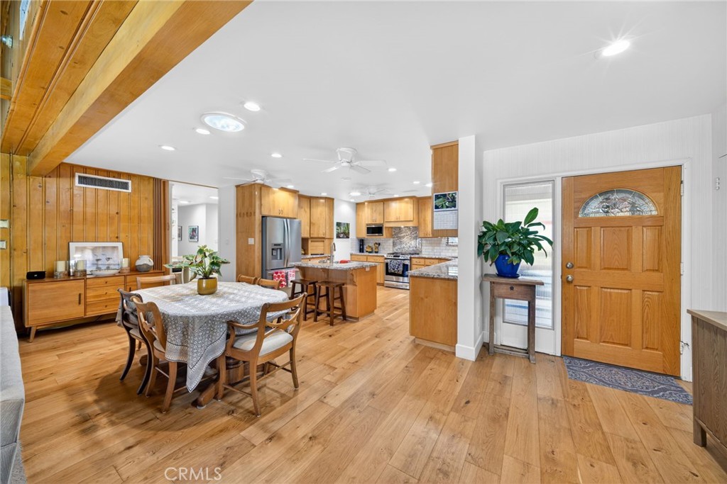 4872 N Arcade Fresno, CA 93704 - Photo 9 of 75 a view of a dining room with furniture window and wooden floor