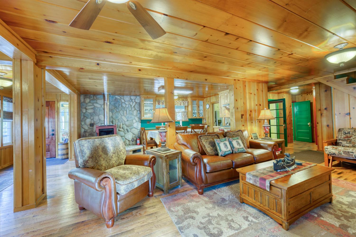 42025 Tollhouse Road Shaver Lake, CA 93664 - Photo 34 of 64 a living room with furniture and a chandelier