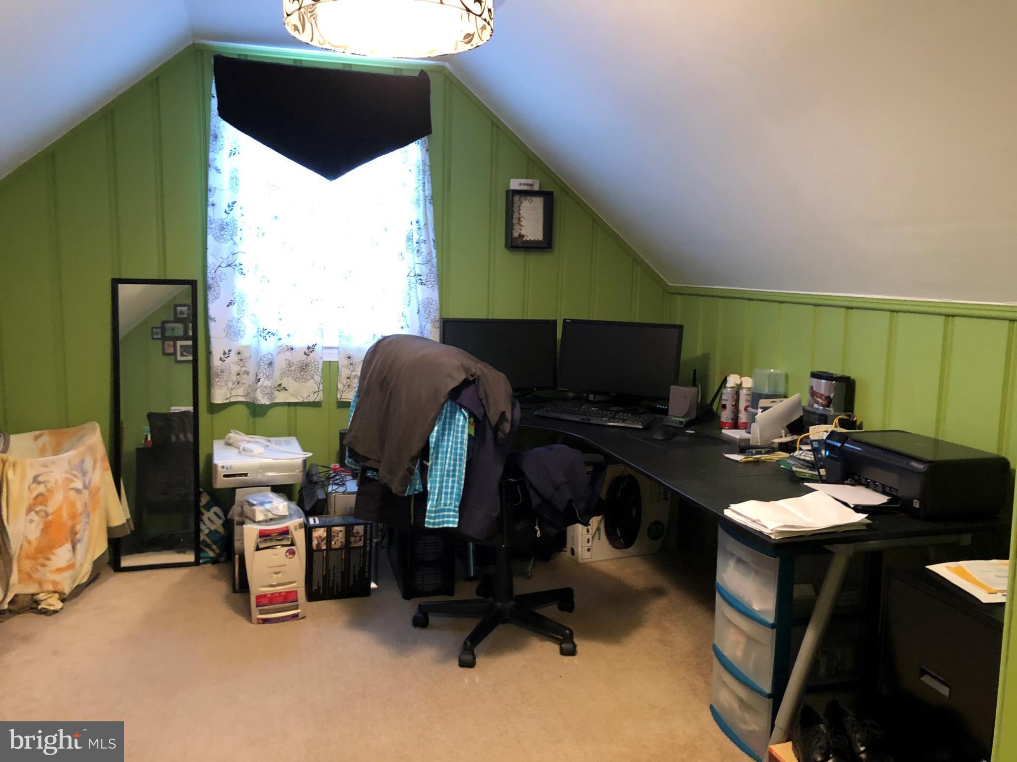 2416 Meadow Road Baltimore, MD 21222 - Photo 20 of 22 a work room with furniture a rug and a window