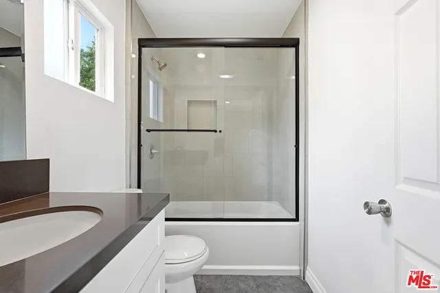 a bathroom with a toilet a sink and a bathtub