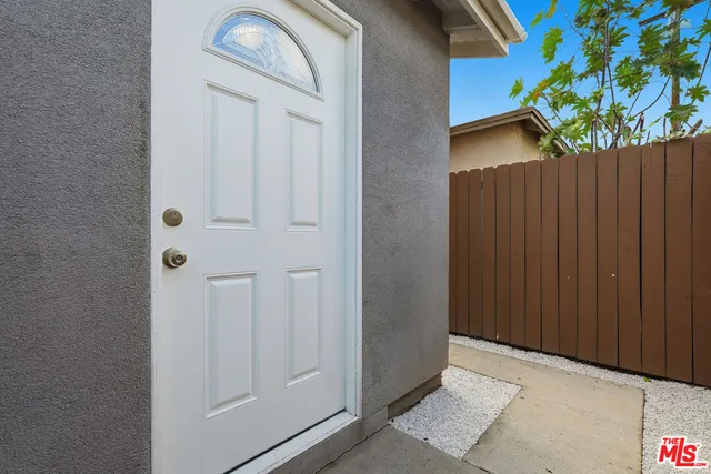 a view of an entryway with wooden floor