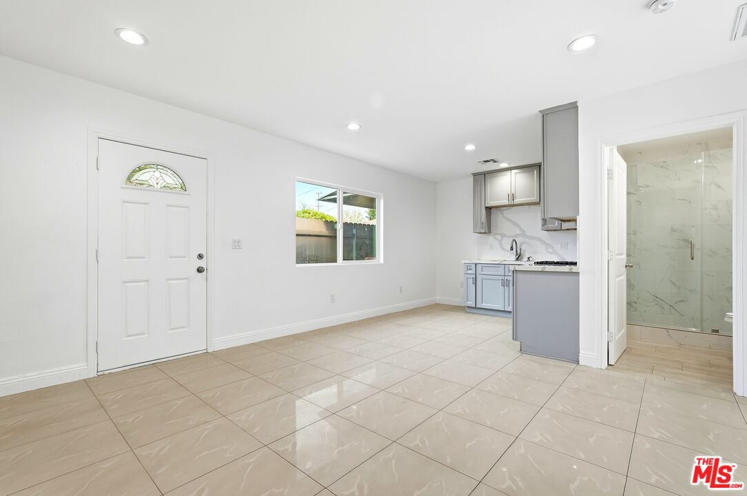 18149 Welby Way Reseda, CA 91335 - Photo 16 of 50 a view of a kitchen with a sink and a refrigerator
