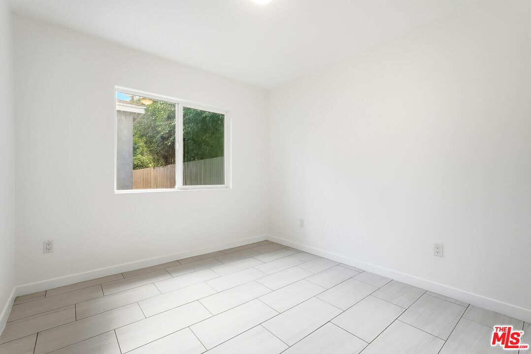18149 Welby Way Reseda, CA 91335 - Photo 23 of 50 an empty room with a window