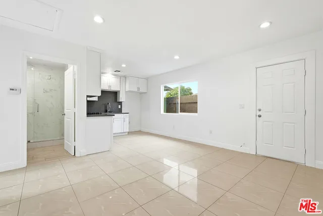 a view of a kitchen with electric appliances