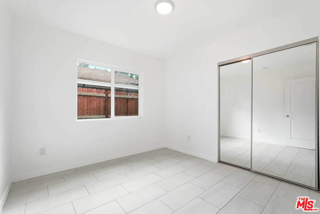 18149 Welby Way Reseda, CA 91335 - Photo 40 of 50 an empty room with windows
