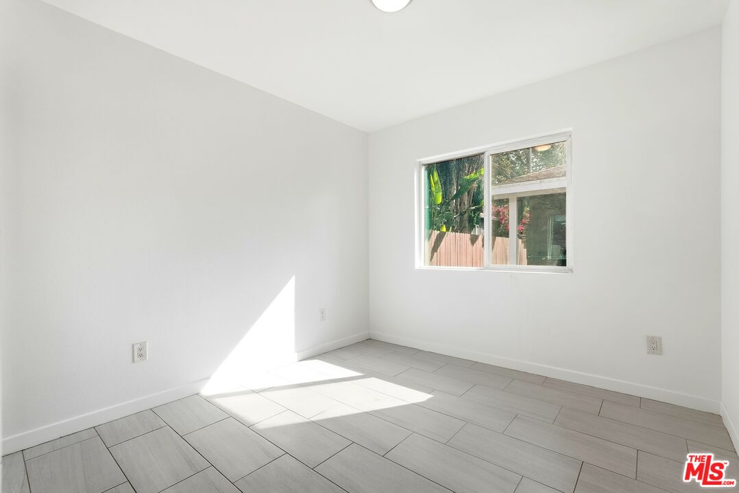18149 Welby Way Reseda, CA 91335 - Photo 42 of 50 an empty room with windows
