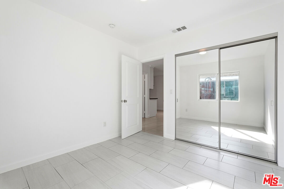 18149 Welby Way Reseda, CA 91335 - Photo 43 of 50 a view of an empty room with window