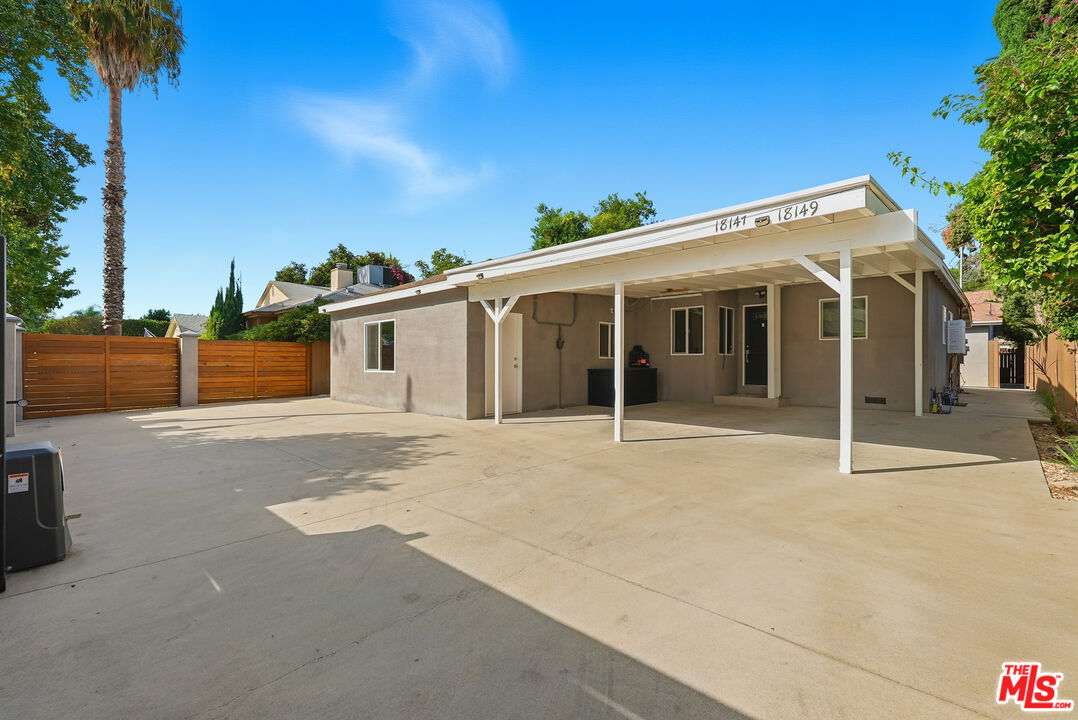 18149 Welby Way Reseda, CA 91335 - Photo 49 of 50 a front view of a house with a garage
