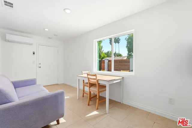 a work room with furniture and a window
