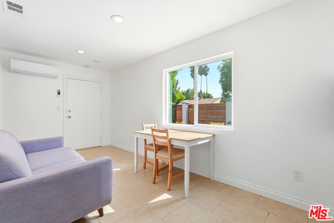 18149 Welby Way Reseda, CA 91335 - Photo 8 of 50 a work room with furniture and a window
