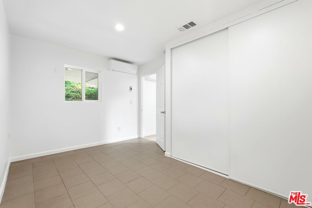 18149 Welby Way Reseda, CA 91335 - Photo 9 of 50 an empty room with windows