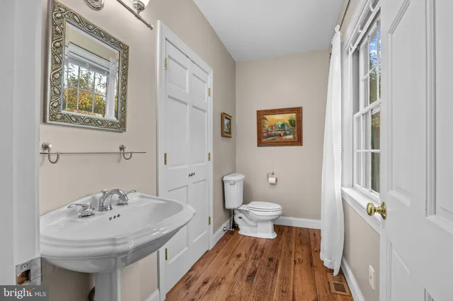 a kitchen with stainless steel appliances kitchen island granite countertop a refrigerator and a stove top oven