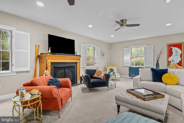 a living room with furniture and painting on the wall
