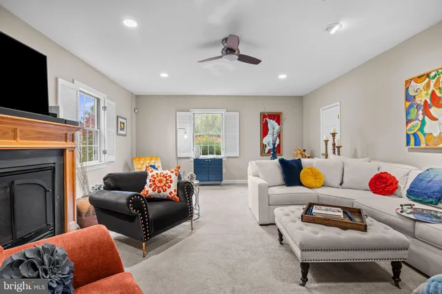 a view of a workspace with bookshelf and a workspace