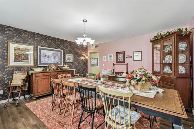 a view of a dining room with furniture and a large window