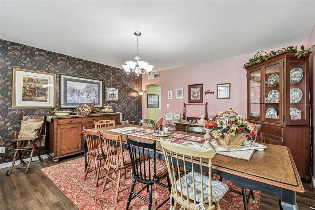 33937 St Benedict Road San Antonio, FL 33576 - Photo 13 of 58 a view of a dining room with furniture and chandelier