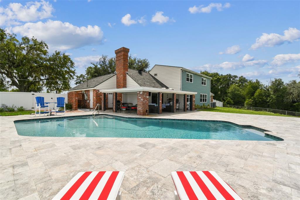 33937 St Benedict Road San Antonio, FL 33576 - Photo 2 of 58 a front view of a house with a yard