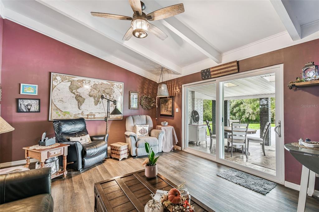 33937 St Benedict Road San Antonio, FL 33576 - Photo 21 of 58 a living room with furniture and a large window