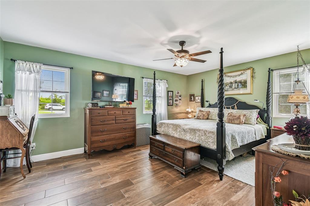 33937 St Benedict Road San Antonio, FL 33576 - Photo 25 of 58 a bed room with a bed and furniture