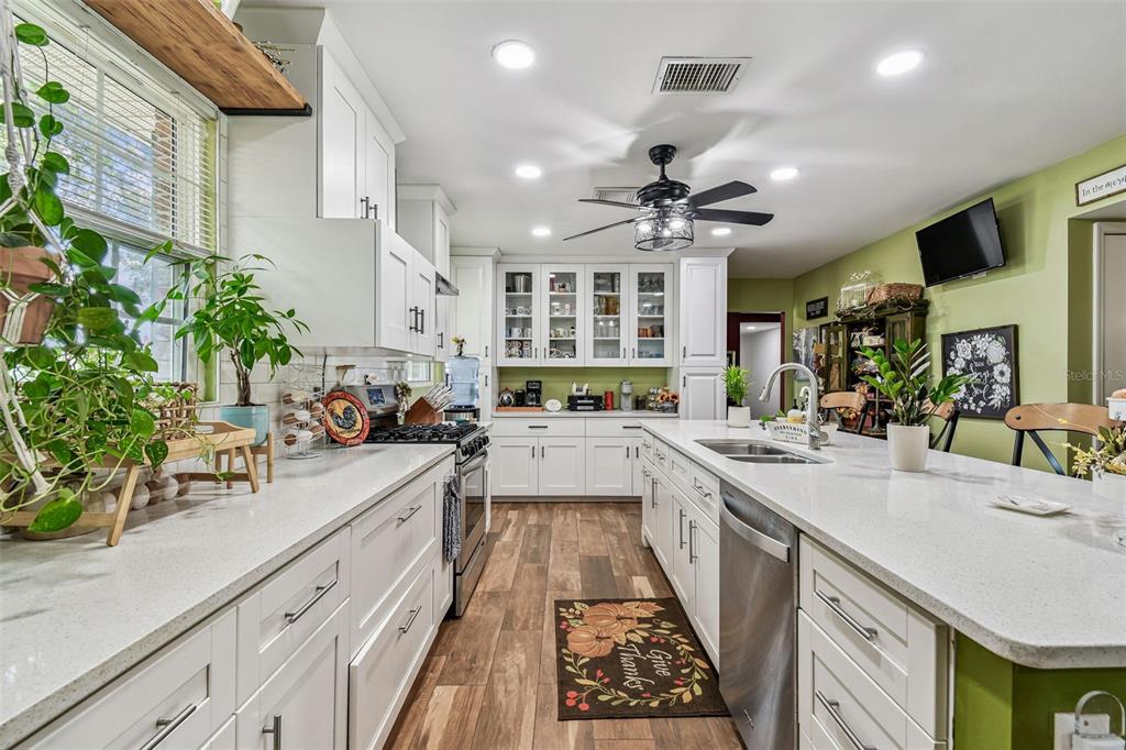 33937 St Benedict Road San Antonio, FL 33576 - Photo 3 of 58 a large kitchen with stainless steel appliances lots of counter space and a sink