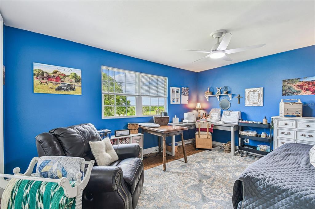 33937 St Benedict Road San Antonio, FL 33576 - Photo 35 of 58 a view of a livingroom with workspace and a couch