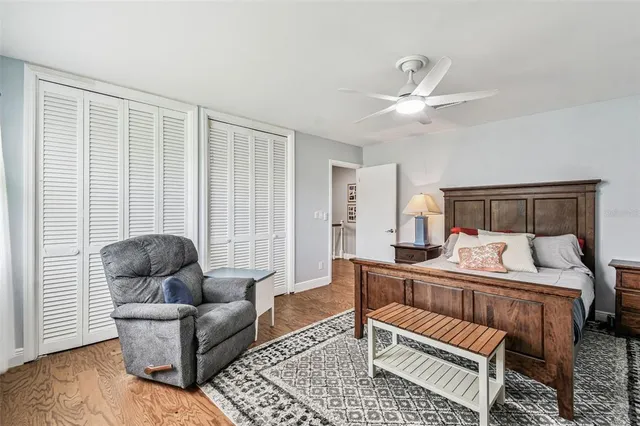 a bedroom with furniture and a air conditioner