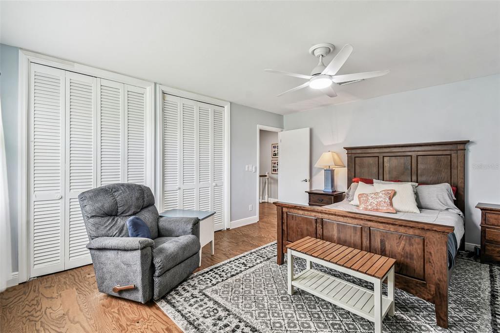 33937 St Benedict Road San Antonio, FL 33576 - Photo 38 of 58 a bedroom with furniture and a large window