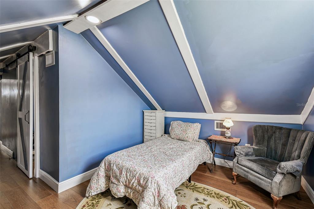 33937 St Benedict Road San Antonio, FL 33576 - Photo 43 of 58 a bed room with a bed and a couch