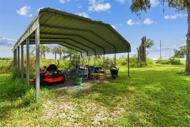 an aerial view of a house with swimming pool garden and patio