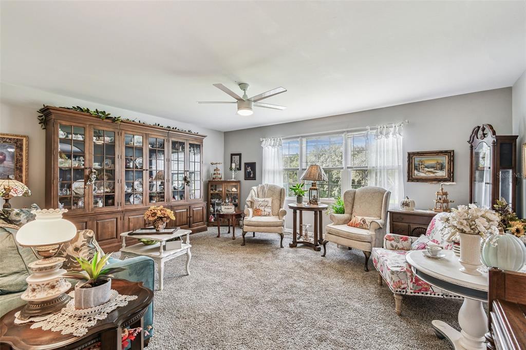 33937 St Benedict Road San Antonio, FL 33576 - Photo 8 of 58 a living room with furniture and a large window