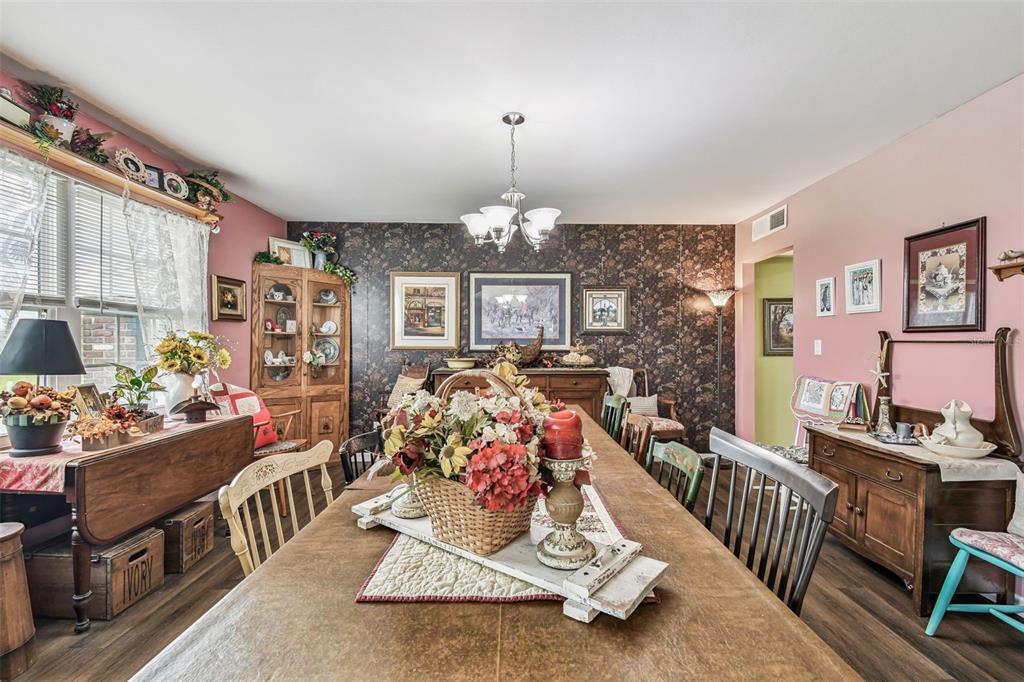 33937 St Benedict Road San Antonio, FL 33576 - Photo 10 of 58 a living room with furniture and a chandelier