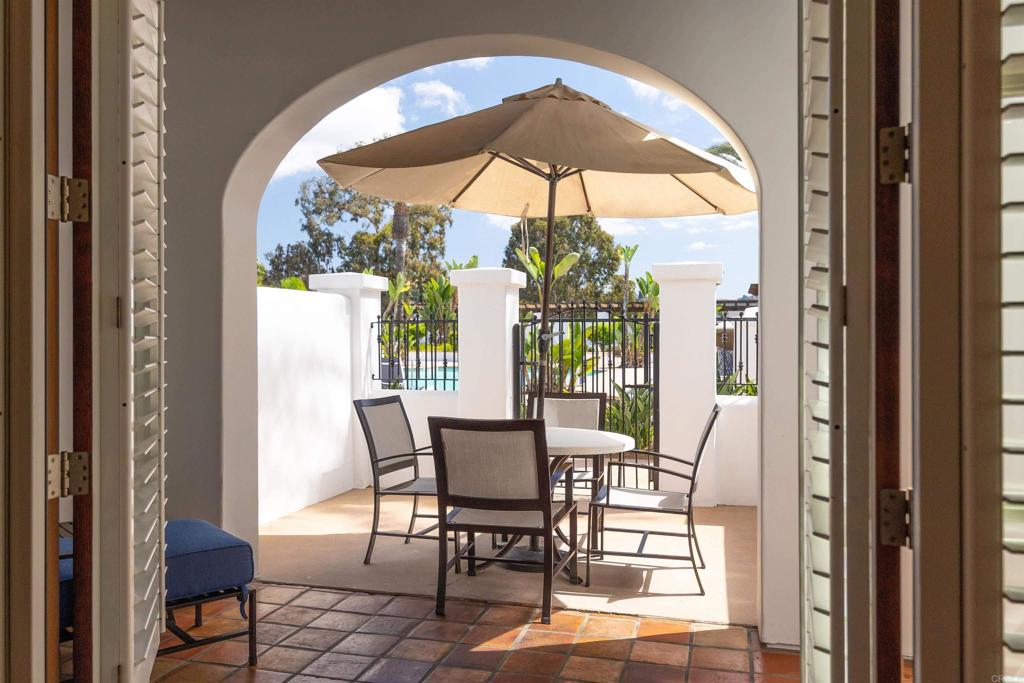 7310 Estrella De Mar Road, Unit 6 Carlsbad, CA 92009 - Photo 11 of 46 a view of a dining room with furniture window and outside view