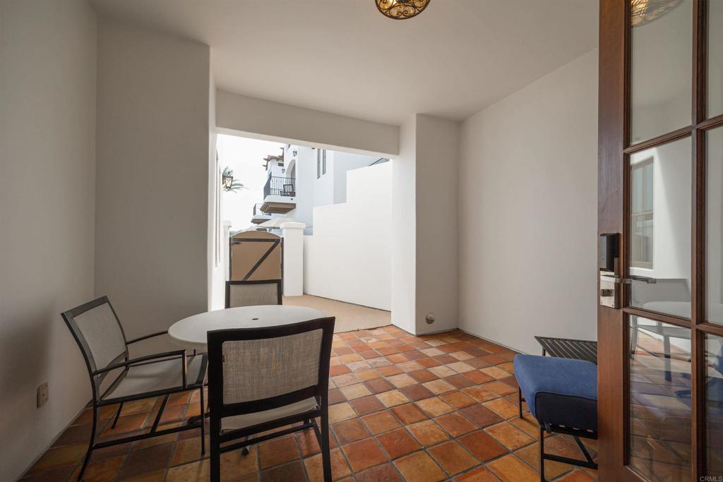 7310 Estrella De Mar Road, Unit 6 Carlsbad, CA 92009 - Photo 26 of 46 a view of a workspace with furniture and a window