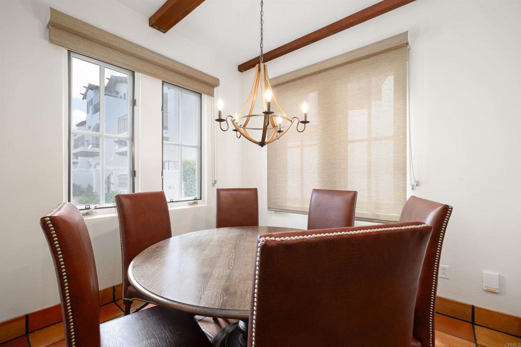 7310 Estrella De Mar Road, Unit 6 Carlsbad, CA 92009 - Photo 7 of 46 a dining room with furniture and window