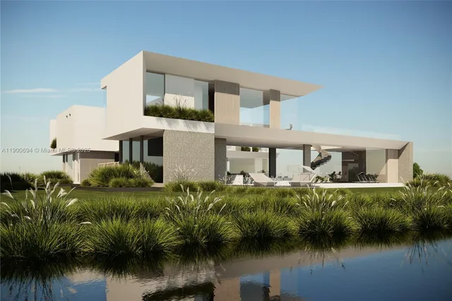 a front view of a house with a lake view