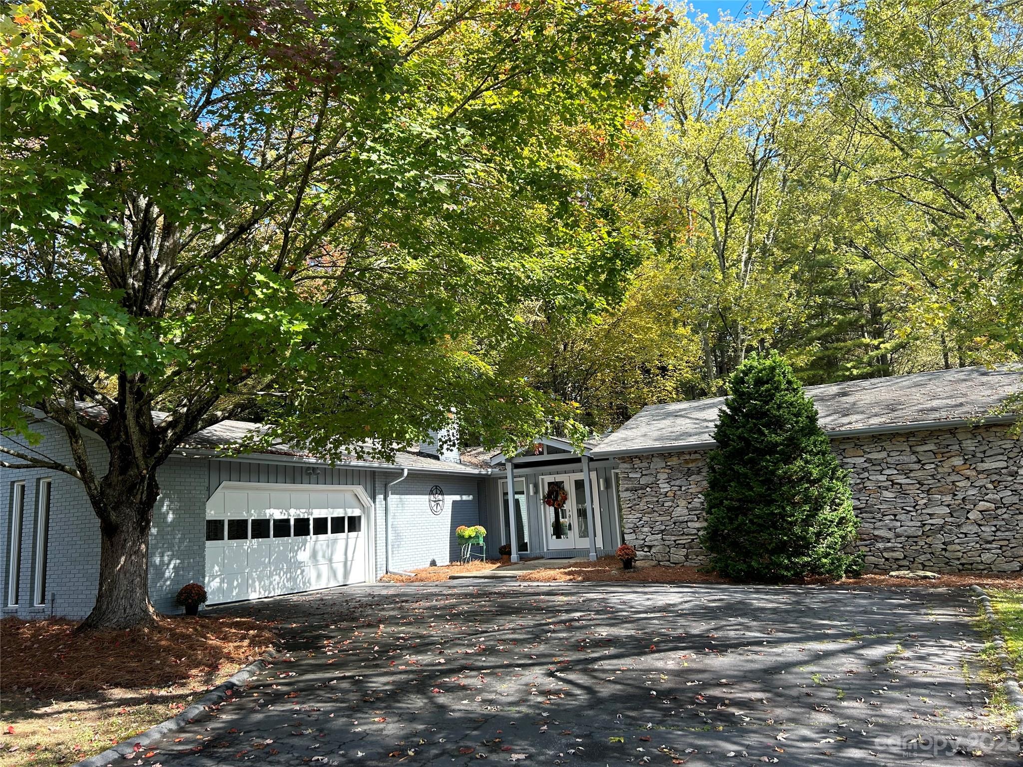 428 Brandon Road Hendersonville, NC 28739 - Photo 1 of 48 a front view of a house with a yard
