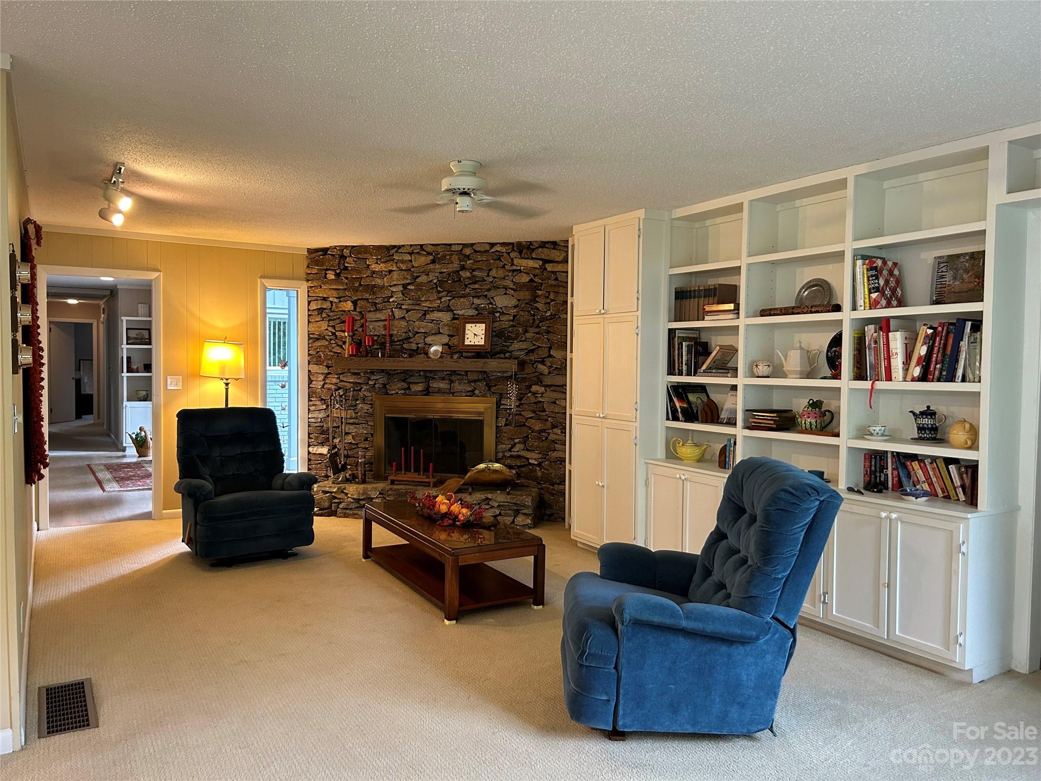428 Brandon Road Hendersonville, NC 28739 - Photo 16 of 48 a living room with furniture and a fireplace