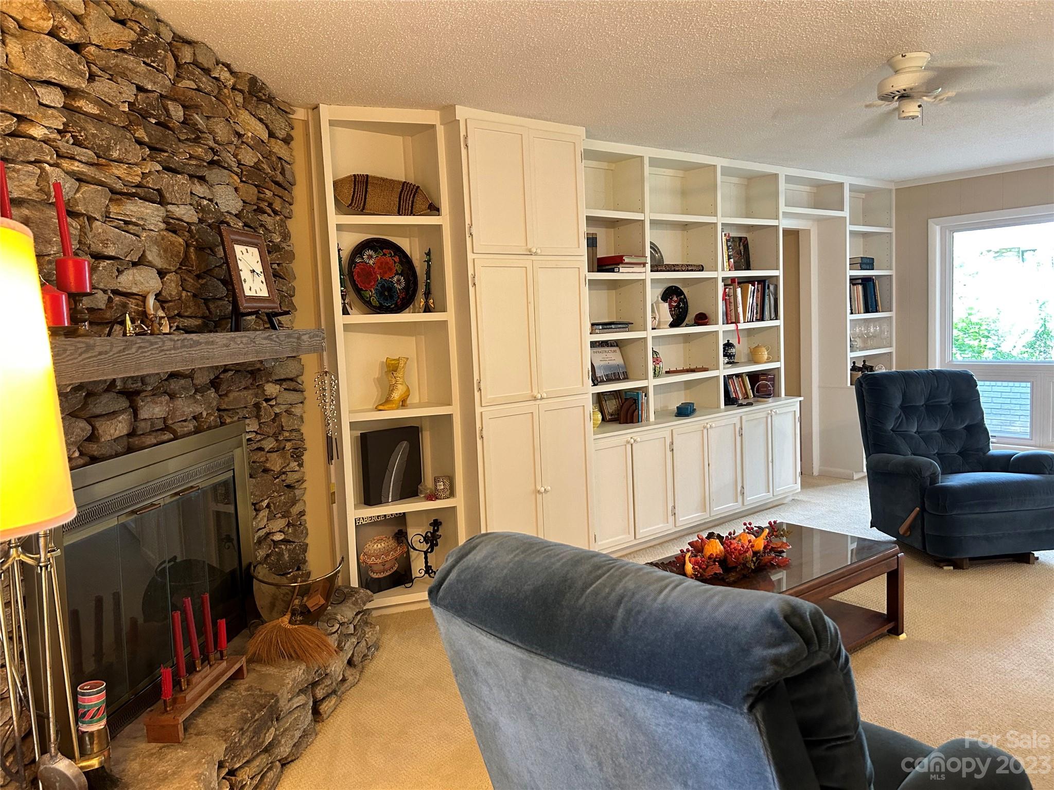 428 Brandon Road Hendersonville, NC 28739 - Photo 17 of 48 a living room with furniture fireplace and flat screen tv