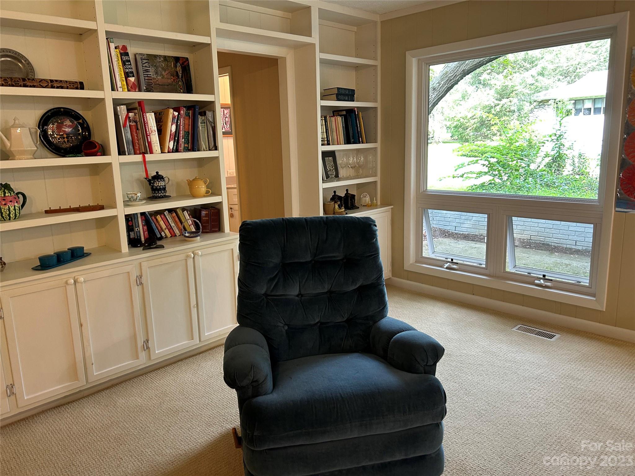 428 Brandon Road Hendersonville, NC 28739 - Photo 18 of 48 a living room with furniture cabinets and a window
