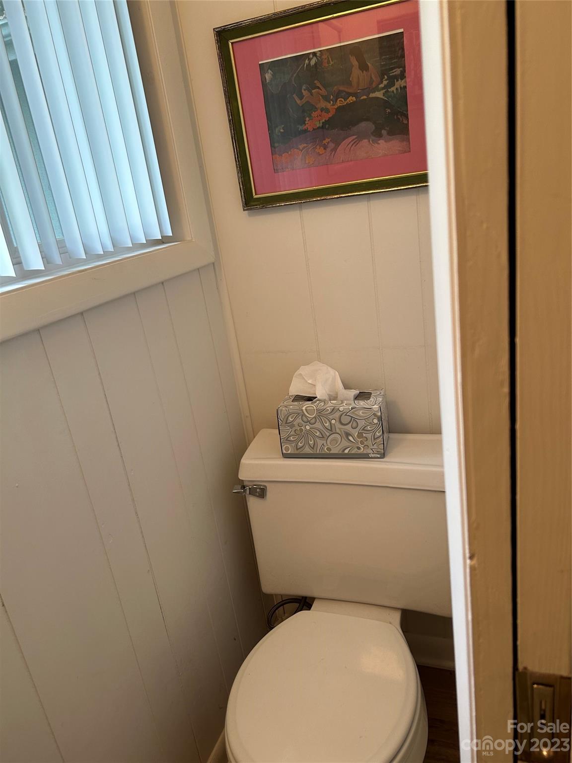 428 Brandon Road Hendersonville, NC 28739 - Photo 25 of 48 a white toilet sitting next to a small bathroom