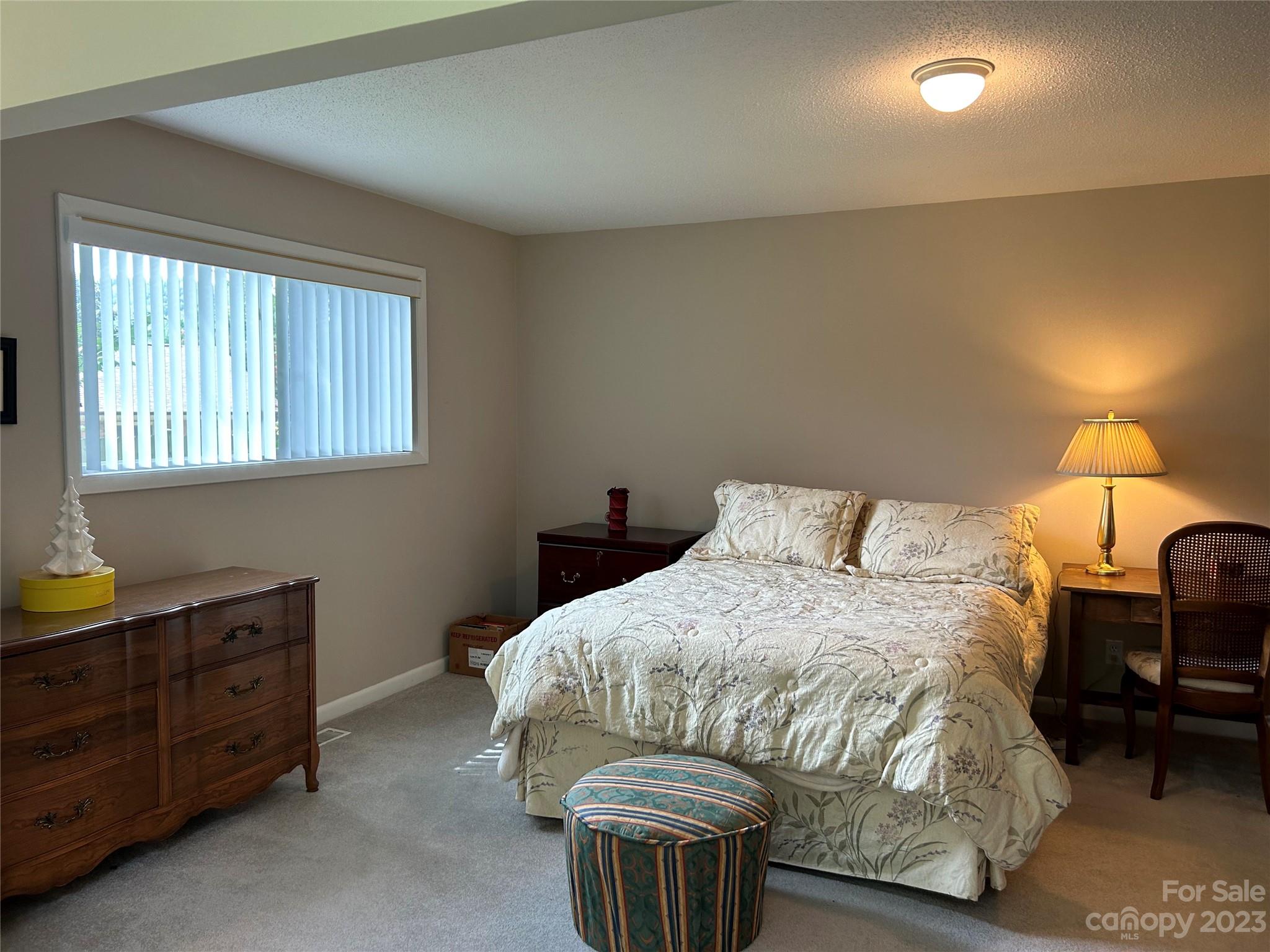 428 Brandon Road Hendersonville, NC 28739 - Photo 26 of 48 a bedroom with a bed and furniture