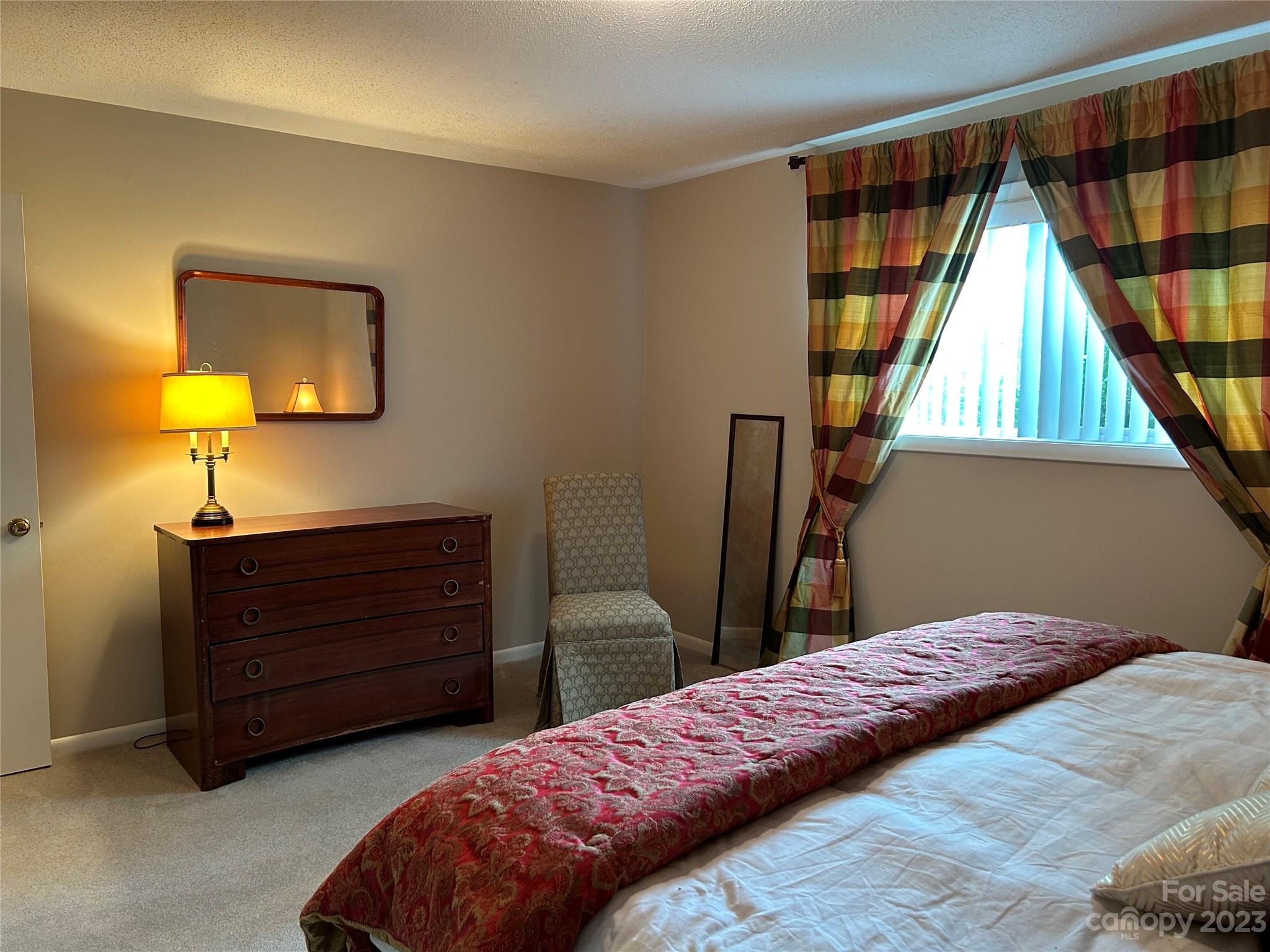 428 Brandon Road Hendersonville, NC 28739 - Photo 35 of 48 a bedroom with a bed and a window