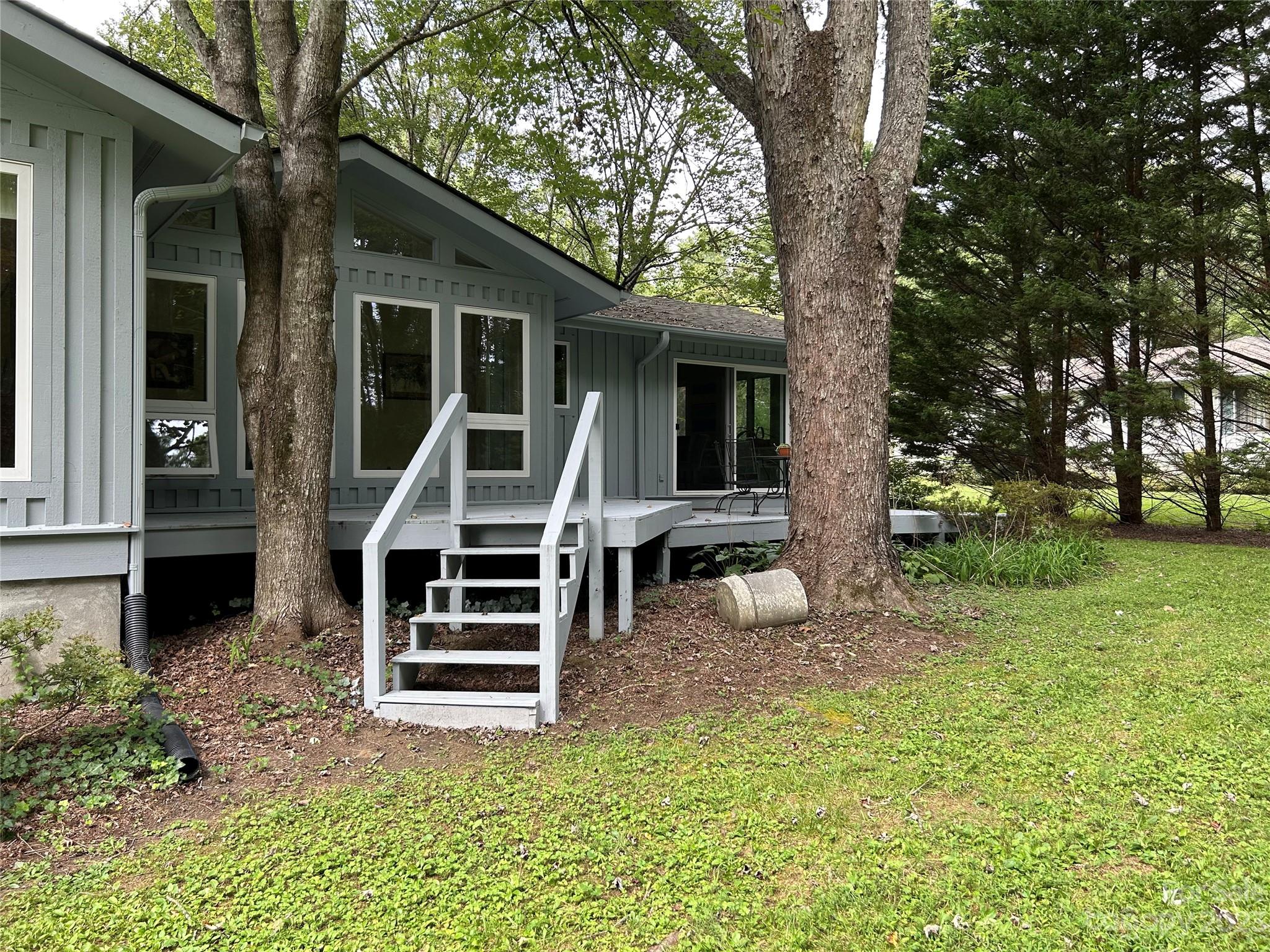 428 Brandon Road Hendersonville, NC 28739 - Photo 41 of 48 a view of a house with a yard